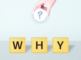 「WHY」の文字と「？」